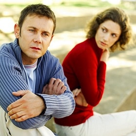 Woman Looking at a Man Sitting Beside Her